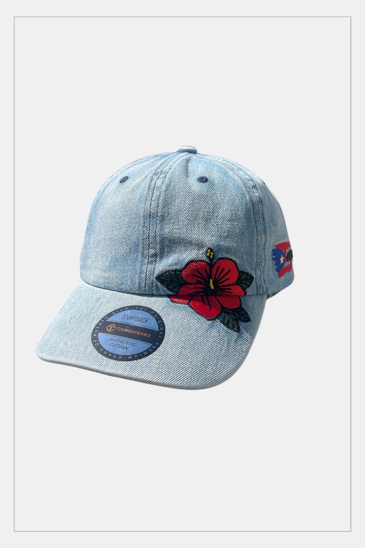 Denim cap with floral design and patches on a white background