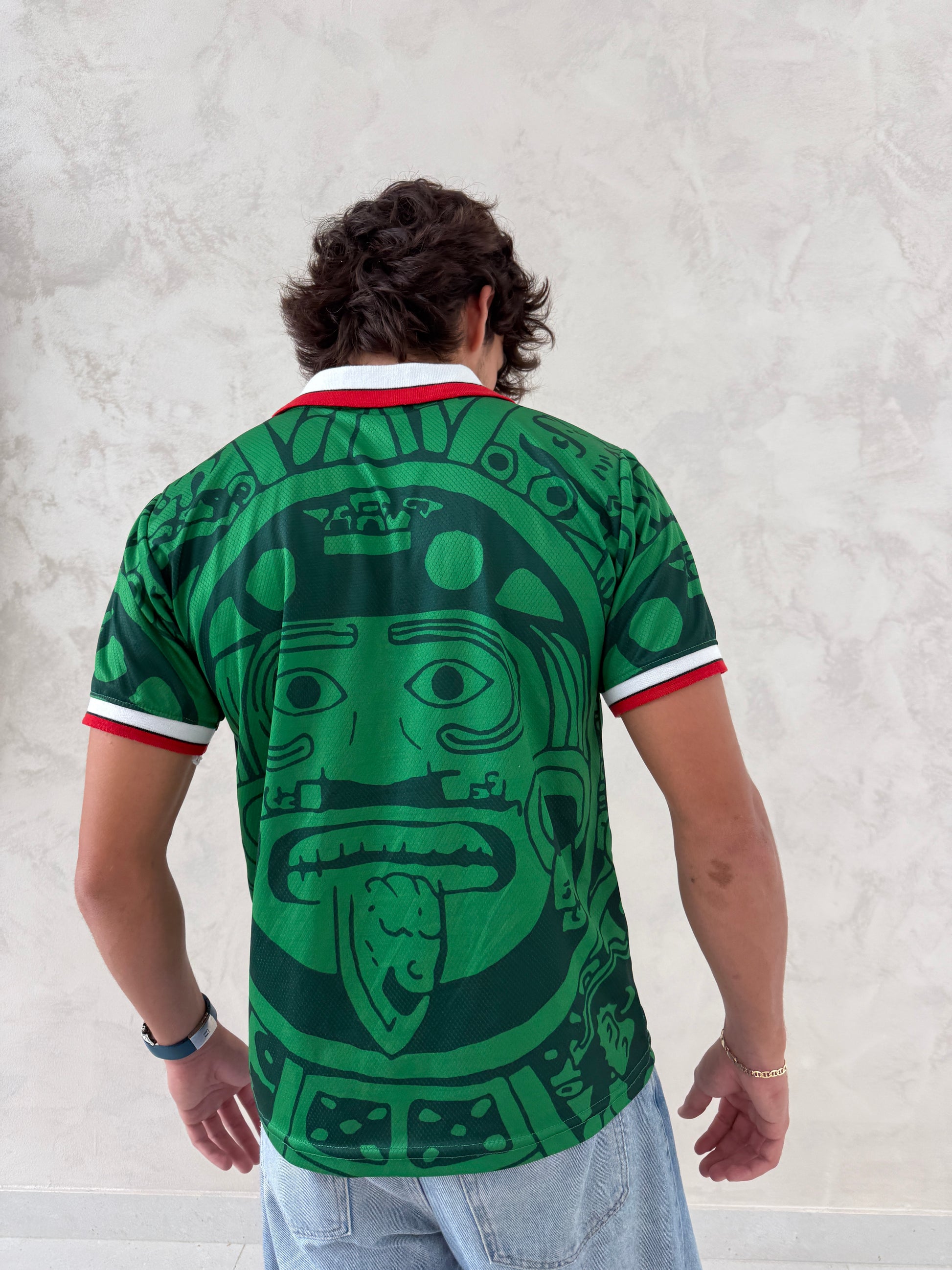 Green cultural pattern jersey styled with casual denim