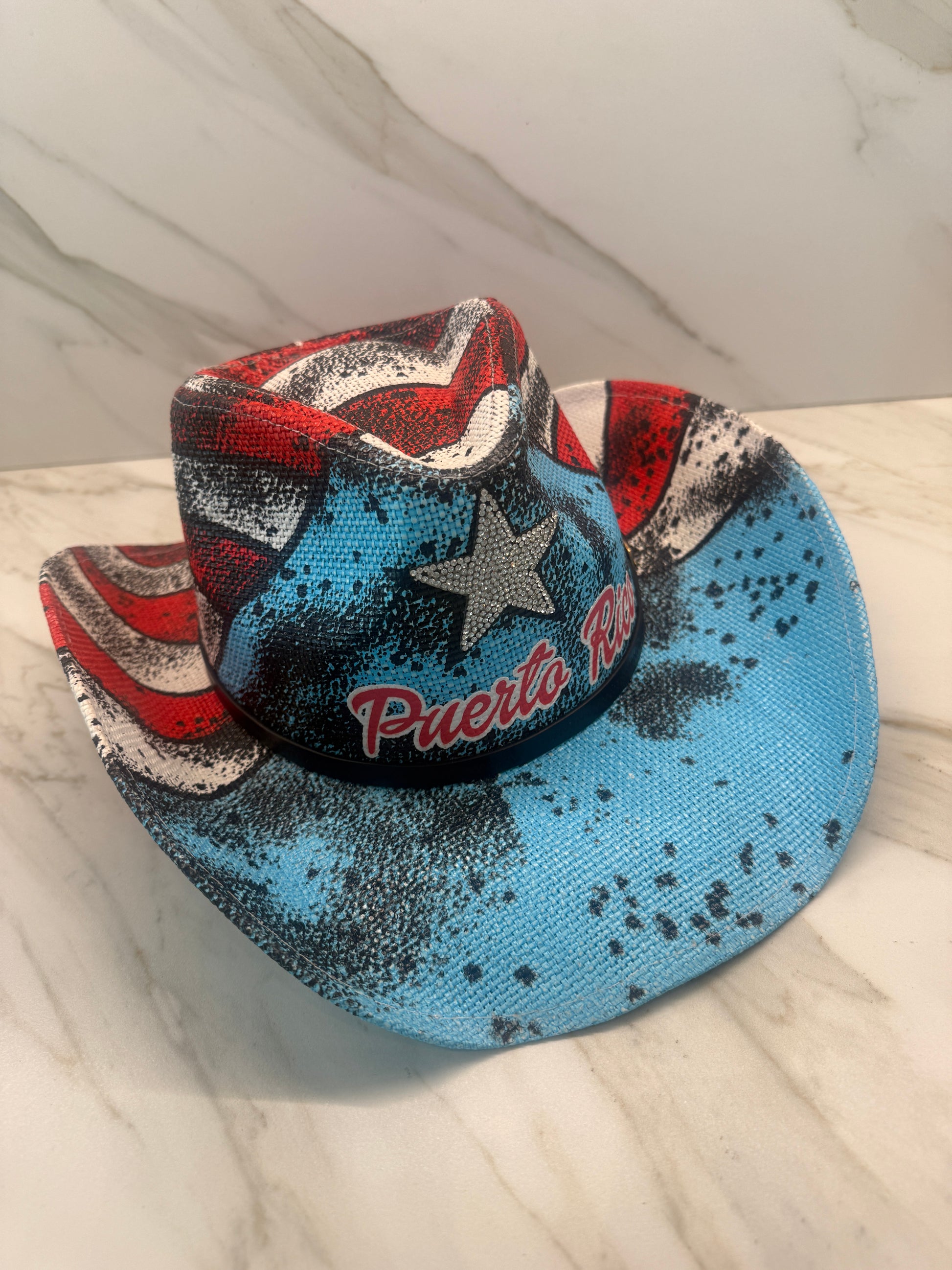 Closeup of Boricua Vaquera PR cowboy hat with distressed island artwork