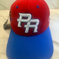 PR Heritage Snapback Hat with red crown blue curved brim and raised 3D embroidery details