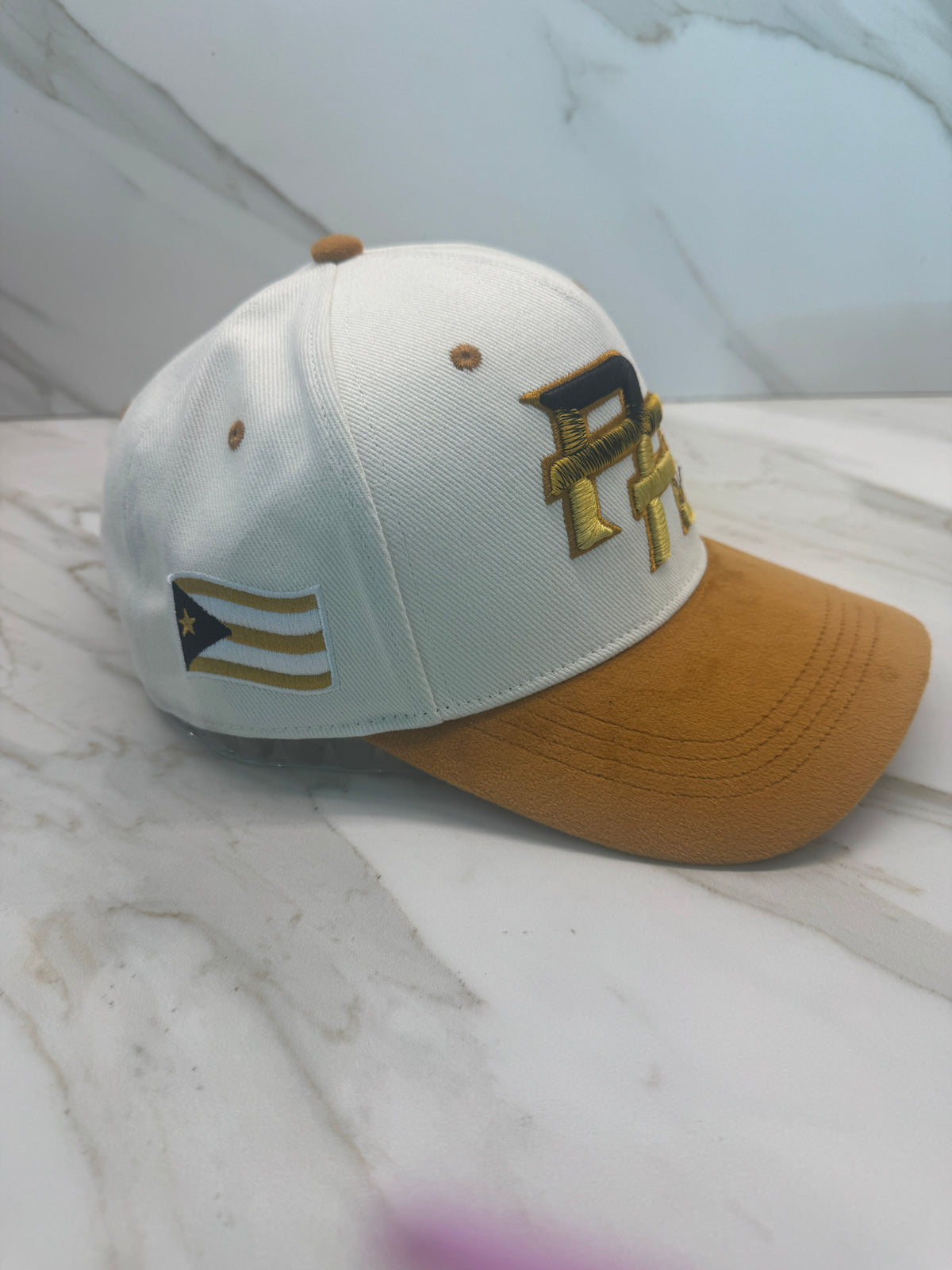 Luxury Puerto Rico PR cap featuring integrated coquí embroidery and gold velvet brim