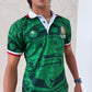 Person wearing a green sports jersey with a graphic design on a light background