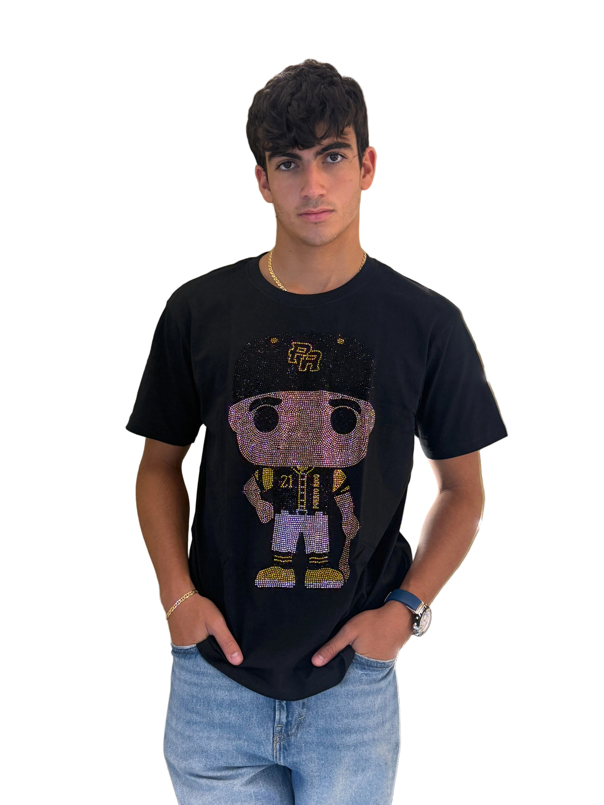 Person wearing a black t-shirt with a colorful graphic design in an indoor setting