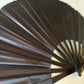 Solid black folding hand fan for parties and festivals