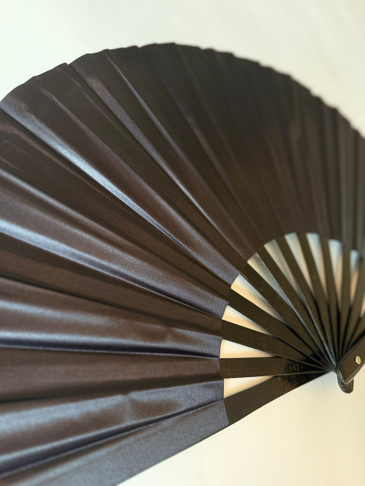 Solid black folding hand fan for parties and festivals