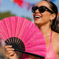 Bright pink folding hand fan with glitter finish